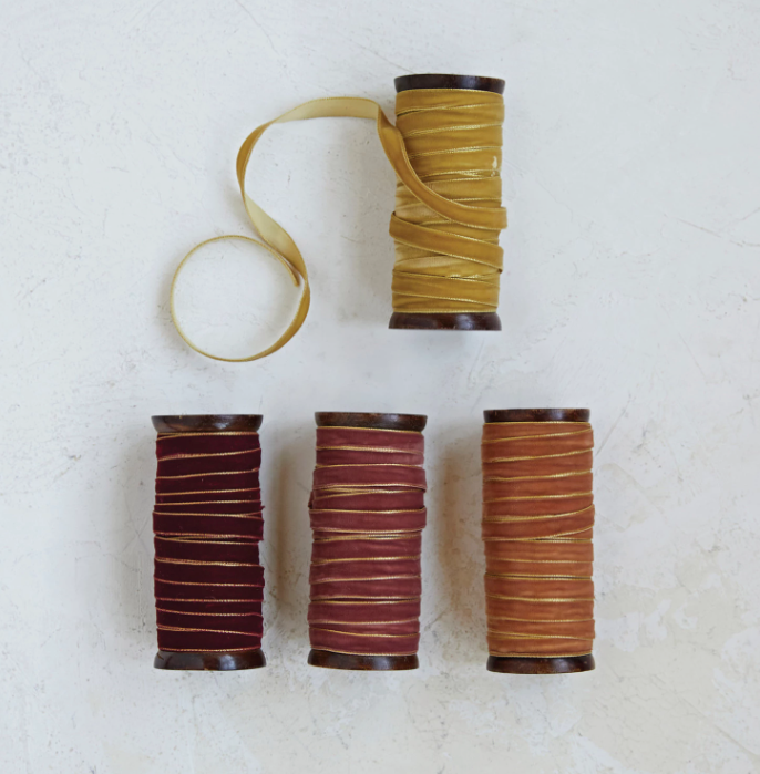 Add a touch of elegance to your crafts and décor with our 10 Yard Velvet Ribbon on Wood Spool. This luxurious ribbon features a rich velvet texture and metallic edges that catch the light beautifully, adding a sophisticated sheen to any project.