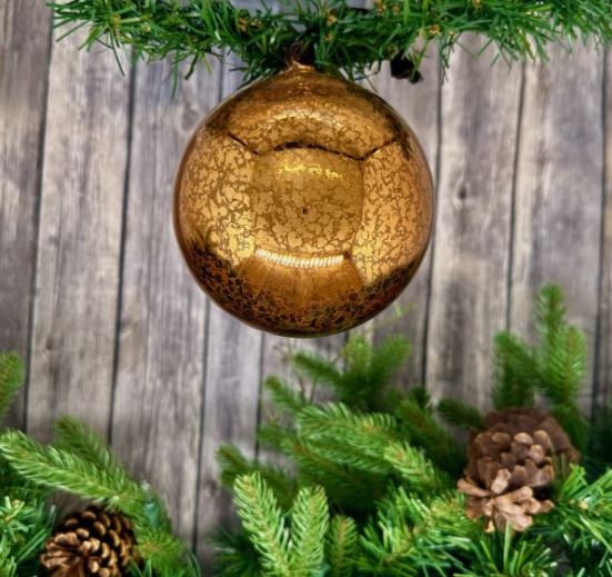 Enhance your holiday decor with our 120mm Hand Blown Top Mercury Glass Ornament in Copper. This stunning ornament features a hand-blown design that showcases a rich copper hue, beautifully reflecting light for a warm and inviting glow.