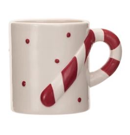 These stoneware holiday mugs with shaped handles are a festive and fun way to enjoy drinks and celebrate the season. The mugs come in three styles, each with a different handle and color, and measure 4.75 inches in length, 3.25 inches in width, and 3.5 inches in height. They have a capacity of 12 ounces and are made of stoneware with a glossy finish and smooth texture.