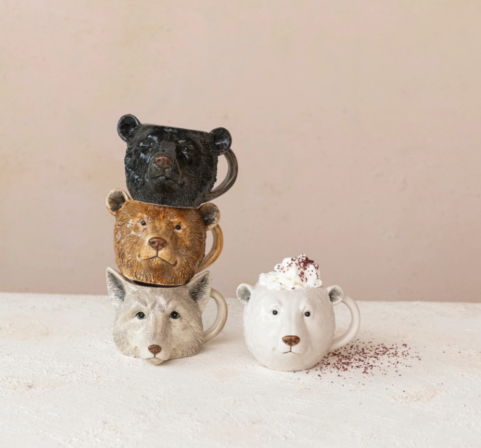 This set of 4 stoneware animal head shaped mugs is a fun and whimsical way to enjoy drinks and enhance the dining experience. The mugs come in 4 styles, each featuring a different animal head shape and color.