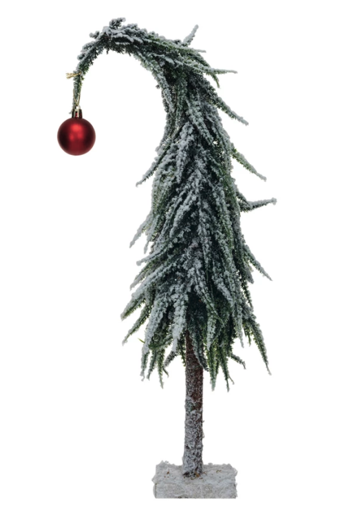 This green and red faux evergreen tree with a wood base and snow finish is a festive and elegant piece that will enhance any space. The tree is a vibrant and cheerful display with a green and red color scheme, a faux evergreen design, a simple wood base, and a snow finish. Its realistic and natural appearance balances its vibrant and inviting atmosphere.