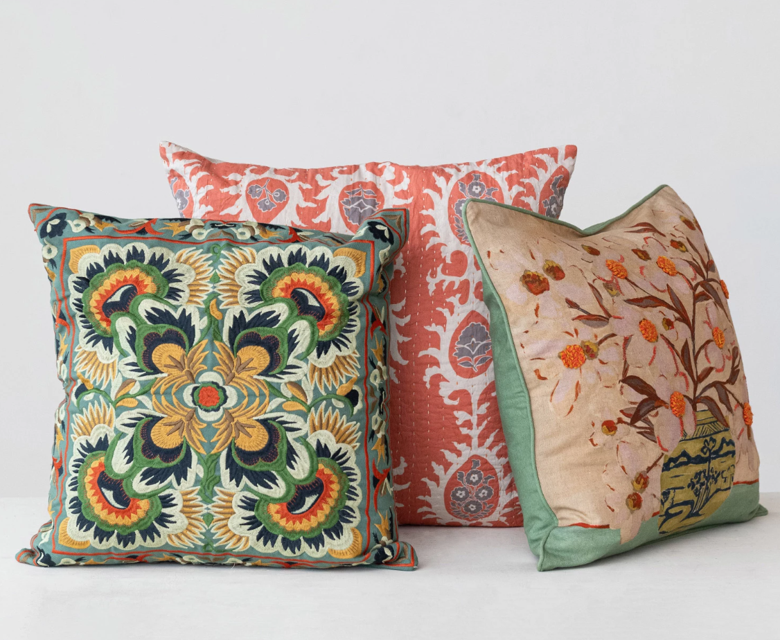 This Multicolor Embroidered Cotton Pillow is a celebration of global craftsmanship and design. Measuring 18 inches square, it's adorned with an intricate embroidery that draws inspiration from Scandinavian, Boho, and global styles. The vivid hues dance across the cotton fabric, inviting the eye and the hand to explore its textured surface