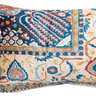 This rectangular lumbar pillow is a celebration of design and comfort. The cotton blend velvet fabric is adorned with a multi-colored vintage carpet pattern, offering both visual intrigue and a soft touch. The pillow's bohemian, eclectic, and global design influences make it a versatile addition to any transitional space.
