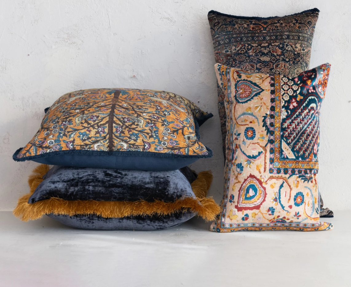 This rectangular lumbar pillow is a celebration of design and comfort. The cotton blend velvet fabric is adorned with a multi-colored vintage carpet pattern, offering both visual intrigue and a soft touch. The pillow's bohemian, eclectic, and global design influences make it a versatile addition to any transitional space.
