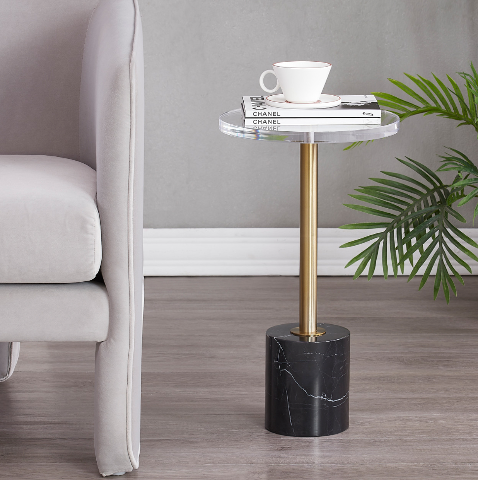 Elevate your living space with the sophisticated elegance of the 21" Elisia Acrylic and Marble Accent Table. This stunning piece blends modern design with timeless materials, featuring a clear acrylic base that offers a contemporary touch, paired with a frosted marble top that exudes luxury. The sleek metal accents provide durability and style, making it a versatile addition to any room.