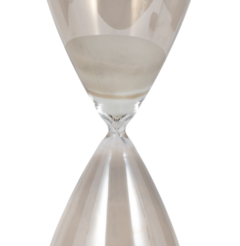 Introducing the&nbsp;23" Galene Large Grey Hourglass, a stunning fusion of elegance and functionality that will elevate the aesthetic of any casual home decor. This exquisite piece, crafted entirely from high-quality glass, showcases a sleek and modern design that seamlessly fits into a variety of interior styles.