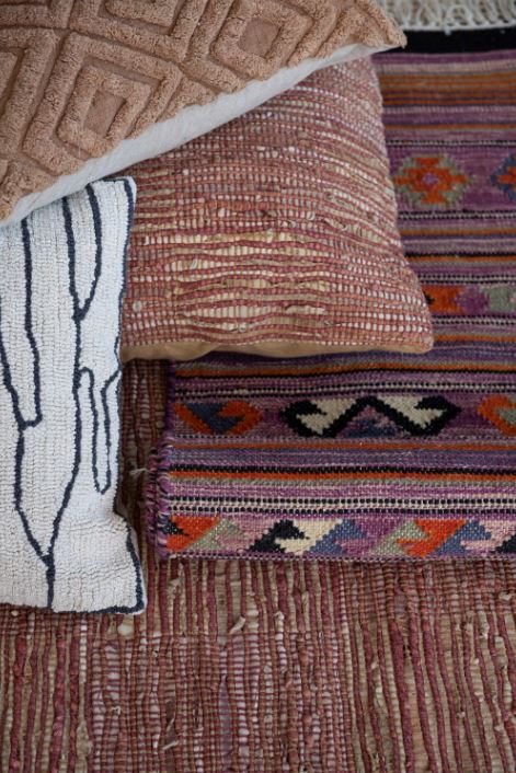 The 32" Square Jute &amp; Leather Chindi Floor Pillow blends rustic charm with modern design, featuring a unique chindi weave crafted from jute and leather in earthy putty and rust tones. Perfect for casual seating or as a statement accent, this generously sized floor pillow adds texture and warmth to any room. Its durable construction ensures long-lasting style, making it an ideal choice for living spaces, reading nooks, or bohemian-inspired decor.
