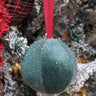 Brighten your space with our 4" Green Soft Ball Hanging Ornament. This charming piece features a lush, vibrant green hue and a plush texture, making it a delightful accent for any room. Perfect for hanging from ceilings, trees, or decorative displays, it adds a playful touch to your decor.