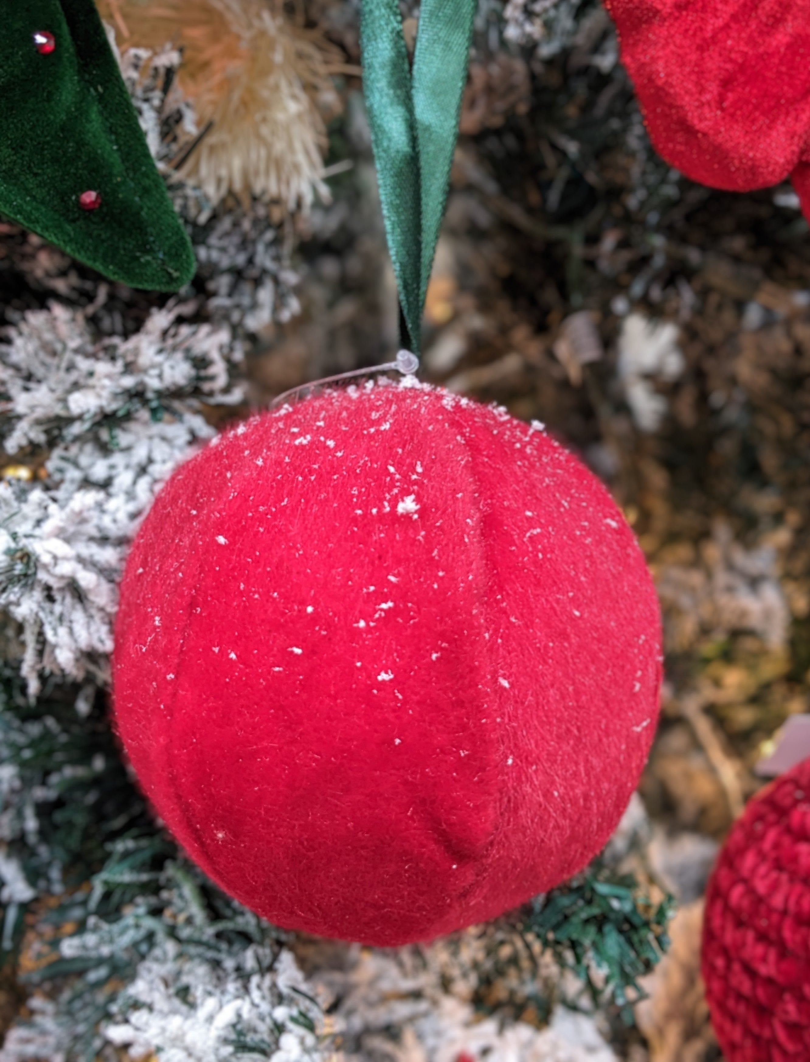 Add a splash of color to your decor with our 4" Red Soft Ball Hanging Ornament. This vibrant ornament features a plush texture and a rich red hue, making it a perfect accent for any space. Ideal for hanging from ceilings, trees, or decorative displays, it brings a playful yet elegant touch to your home