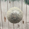 Elevate your holiday decor with our 5" Sequin Beaded Ball Ornament in Silver. This stunning ornament is intricately adorned with shimmering sequins and beads, creating a captivating sparkle that catches the light beautifully