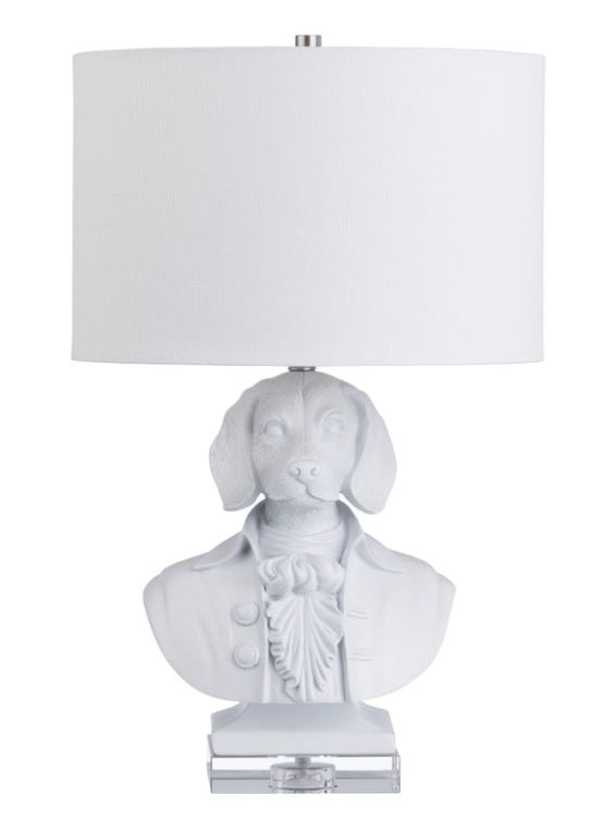 Add a touch of whimsy to your space with the Beauchamp Table Lamp, featuring a charming dog bust dressed in formal attire with a matte white finish. The crisp white linen shade enhances its playful yet sophisticated appeal. Perfect for adding a unique and delightful accent to any room.