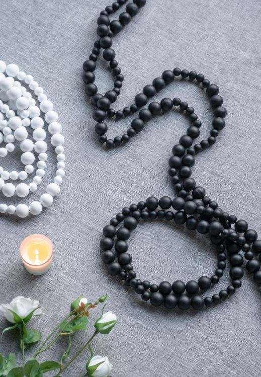 This garland will perfectly complement your decor with black wood beads in a graduated design measuring thirteen feet long. A great addition to any decorating project.