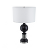 Crafted from a sturdy mix of iron and mango wood, this contemporary table lamp features a black and gray hue, a unique shape including a pedestal base and spherical ball in the middle of the frame, and a classic shade. An ideal size for your bedside table, a desk in your study, or a living room end table, it will catch the eye of your guests from any location. Measurements: 26H x 16D x 16W.