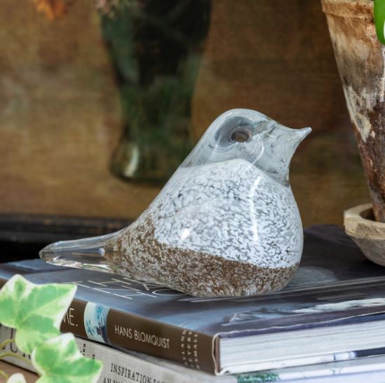 Add a whimsical touch to your decor with our beautifully crafted Blown Glass Finch. This stunning ornament showcases intricate details and vibrant colors, making it a charming addition to your holiday collection or year-round decor. 