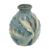 Crafted from 100% high-quality ceramic and sporting an organic reactive glaze finish, this vase boasts an intriguing blend of blue and white colors across the curved surface. Perfect for use as a standalone decorative accent or as a vessel for a custom floral arrangement. Measuring 9W x 9D x 11H, it is an ideal size to be placed on your sideboard, mantelpiece, tabletop, countertop, dresser,