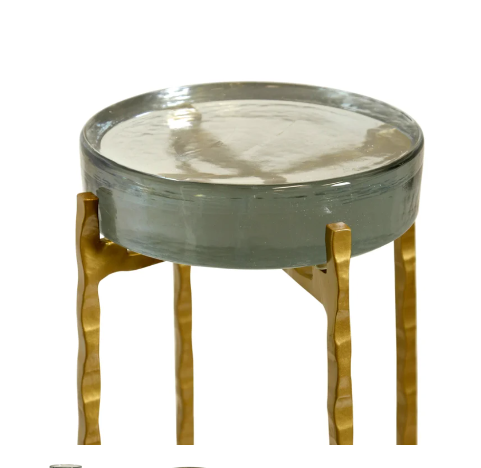 Standing at 23 inches tall with a sleek 9-inch diameter, this eye-catching drink table combines playful design with sophisticated materials to create a stunning accent piece.