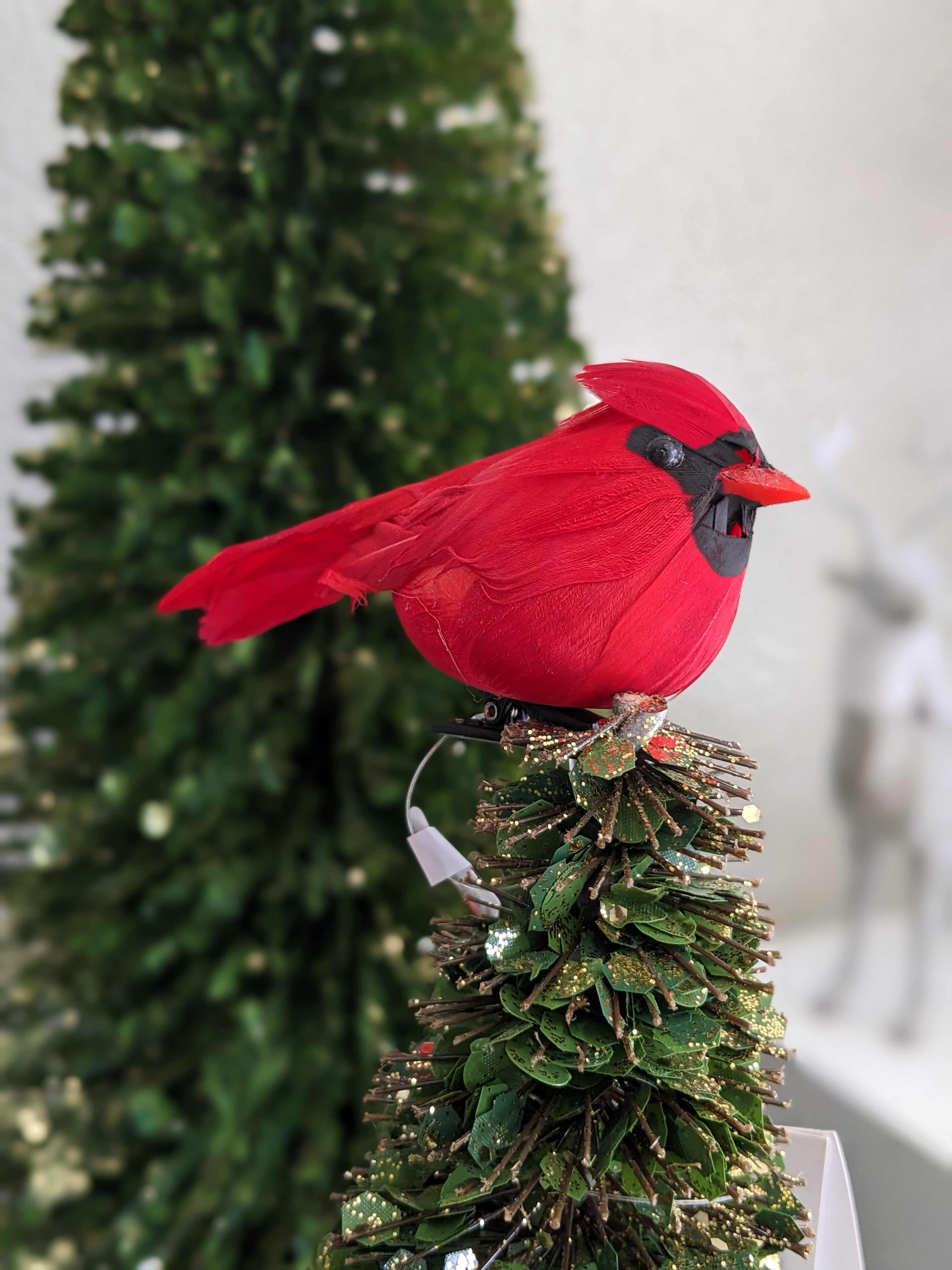 Introduce a touch of festive cheer to your decor with our Cardinal with Clip. This beautifully crafted accent features vibrant red hues and intricate detailing, capturing the essence of this beloved bird.