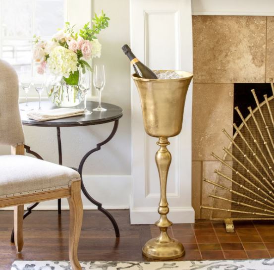 The bright gold finish adds to the festive atmosphere. No need to put it away after the party, it's also a perfect vessel for a fern or other plant.