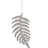 Our Champagne Gem Fern Frond Ornament is like jewelry for your tree. Combining the shape of a natural fern leaf and adding the glitz and glimmer of gems and glitter, this fancy frond will add sparkle to your holiday.