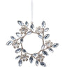 Our Champagne Gem Floral Wreath Ornament is a dazzling bauble with holiday meaning. Exemplifying celebration and eternity as a jeweled wreath created of floral and vine motifs, this shatterproof stunner glistens with gems and glitter, a beautiful symbol of holiday splendor.