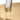 Close-up of a gold surface with a cylindrical object on top