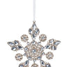 If you are dreaming of a glamorous holiday, you must have our Embellished Gem Ornament. This dazzling bauble is designed in a snowflake motif, its hand placed gems and champagne glitter sparkling brighter than the star atop the tree.