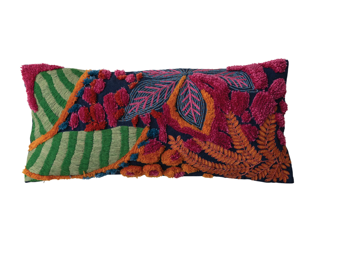 This embroidered fabric indoor/outdoor lumbar pillow features a vibrant and textured design with botanicals and tufting details. The pillow is a cozy addition to any space, adding charm and warmth. The multi-colored embroidered fabric gives it a vibrant and textured look, while the botanical design with tufting details adds personality and beauty. 