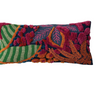 This embroidered fabric indoor/outdoor lumbar pillow features a vibrant and textured design with botanicals and tufting details. The pillow is a cozy addition to any space, adding charm and warmth. The multi-colored embroidered fabric gives it a vibrant and textured look, while the botanical design with tufting details adds personality and beauty. 