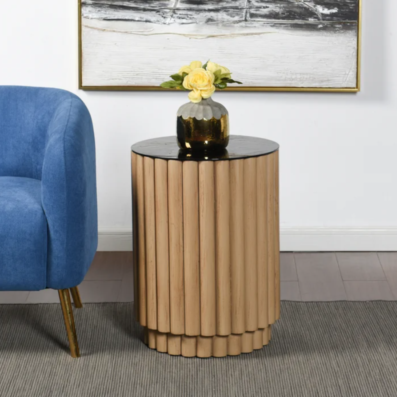  Crafted from natural pine wood, this exquisite piece boasts a unique fluted design that adds texture and depth to any room. The rich, warm tones of the pine wood are beautifully complemented by a sleek black glass table top, creating a striking contrast that enhances the table's elegant aesthetic.