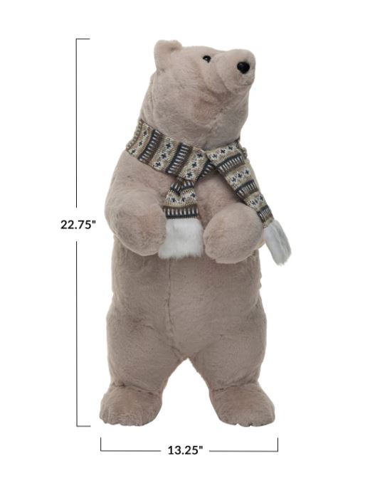 This faux fur upright polar bear is a charming and adorable decorative item that can brighten up the space. It features a smooth, shiny body with cream color and black details, along with a pair of ears, a black nose, and two black eyes. The scarf is red and white with a striped pattern.