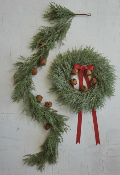 Bring a touch of rustic charm and natural beauty to the holiday décor or year-round displays with this delightful faux cedar garland with rust bells. Realistic faux cedar fronds in a lush green color create a natural foundation, while the decorative metal bells with a rust finish add a touch of vintage charm.