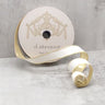 Elevate your decor with our White Flocked Velvet Ribbon with Metallic Gold Back. Measuring 1" wide and 25 yards long, this luxurious ribbon features a soft, plush white velvet front adorned with intricate flocked patterns and a shimmering metallic gold back.