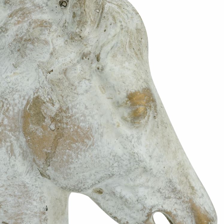 Masterfully crafted by skilled artisans, this decorative statue features an intricately detailed horse head, complete with a natural gray finish, occasional flashes of gold, and a sturdy black iron base for both stability and contrast. Whether it is displayed on its own or as part of a nature-inspired vignette, it is sure to infuse your home decor with a regal, commanding air.