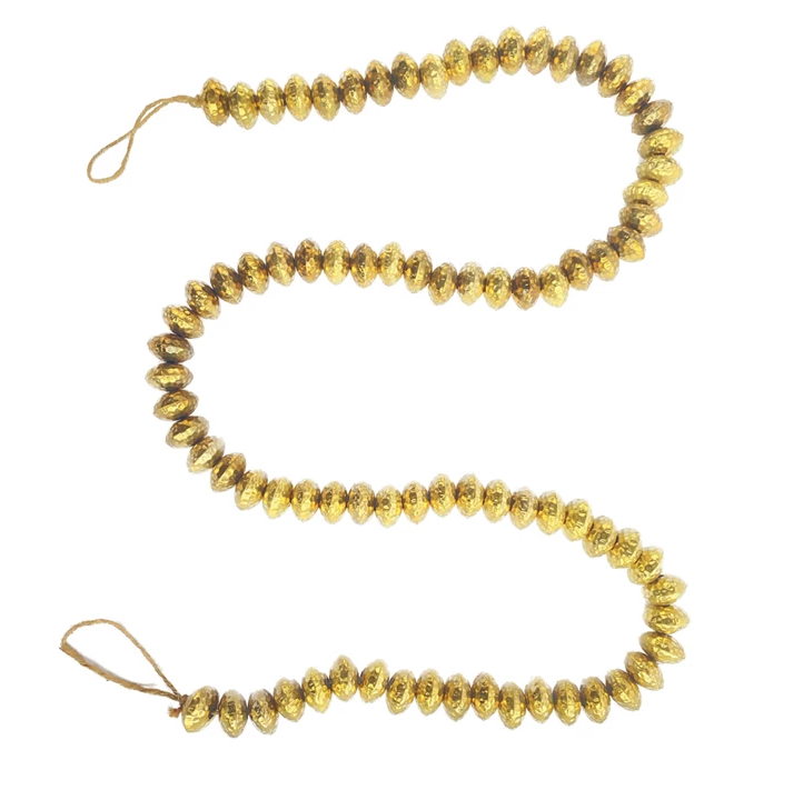 This stunning 72-inch-long hammered metal bead garland adds a touch of elegance and sophistication to holiday décor or special occasions. The rich brass finish on each individual hammered metal bead catches the light beautifully, creating a cascading or draped effect that complements a variety of decorating styles. Made from durable metal, this garland is built to last and can be enjoyed for years to come.