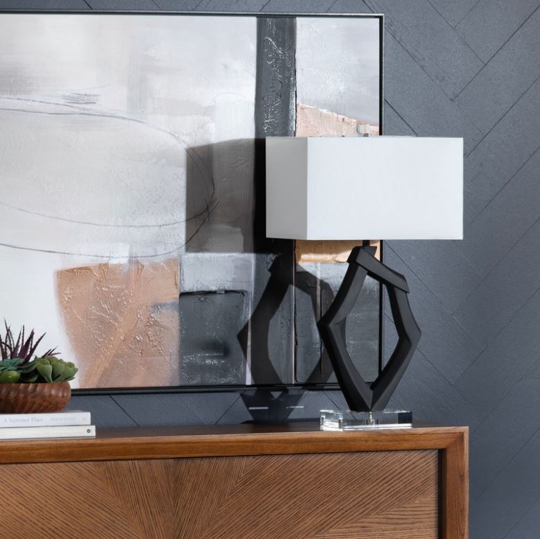 Introducing the Laurence Whimsical Table Lamp, a unique and artistic addition to your home decor. Standing at 31.25 inches tall with dimensions of 17 inches in length and 11 inches in width, this lamp features a striking organic shape crafted from durable resin.