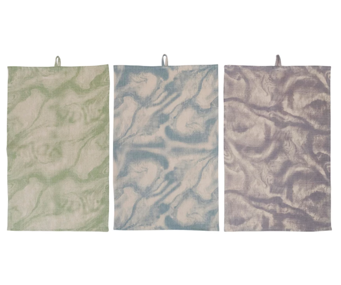 These towels feature a sophisticated marble print that blends modern design with everyday practicality.