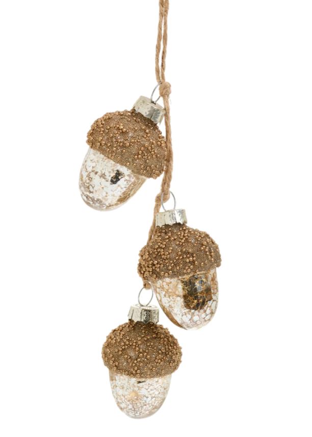 Add a touch of whimsy to your holiday decor with our Silver and Gold Glass Acorn Cluster Ornament. This delightful piece features a beautiful arrangement of acorns, blending shimmering silver and warm gold tones for a stylish and festive look.