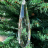 This stunning piece features a sparkling crystal design that catches the light beautifully, creating a mesmerizing effect on your Christmas tree or festive displays. Its sleek shape and brilliant shine make it a perfect accent for both traditional and contemporary decor styles. Whether hung among other ornaments or showcased on its own, this crystal drop ornament brings a sophisticated sparkle to your holiday celebrations, elevating your festive atmosphere!