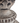 Decorative stone urn with intricate patterns on a white background