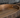 Close-up of a wooden bowl with a rustic finish