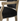 Chair with black cushion and gold frame on a white background