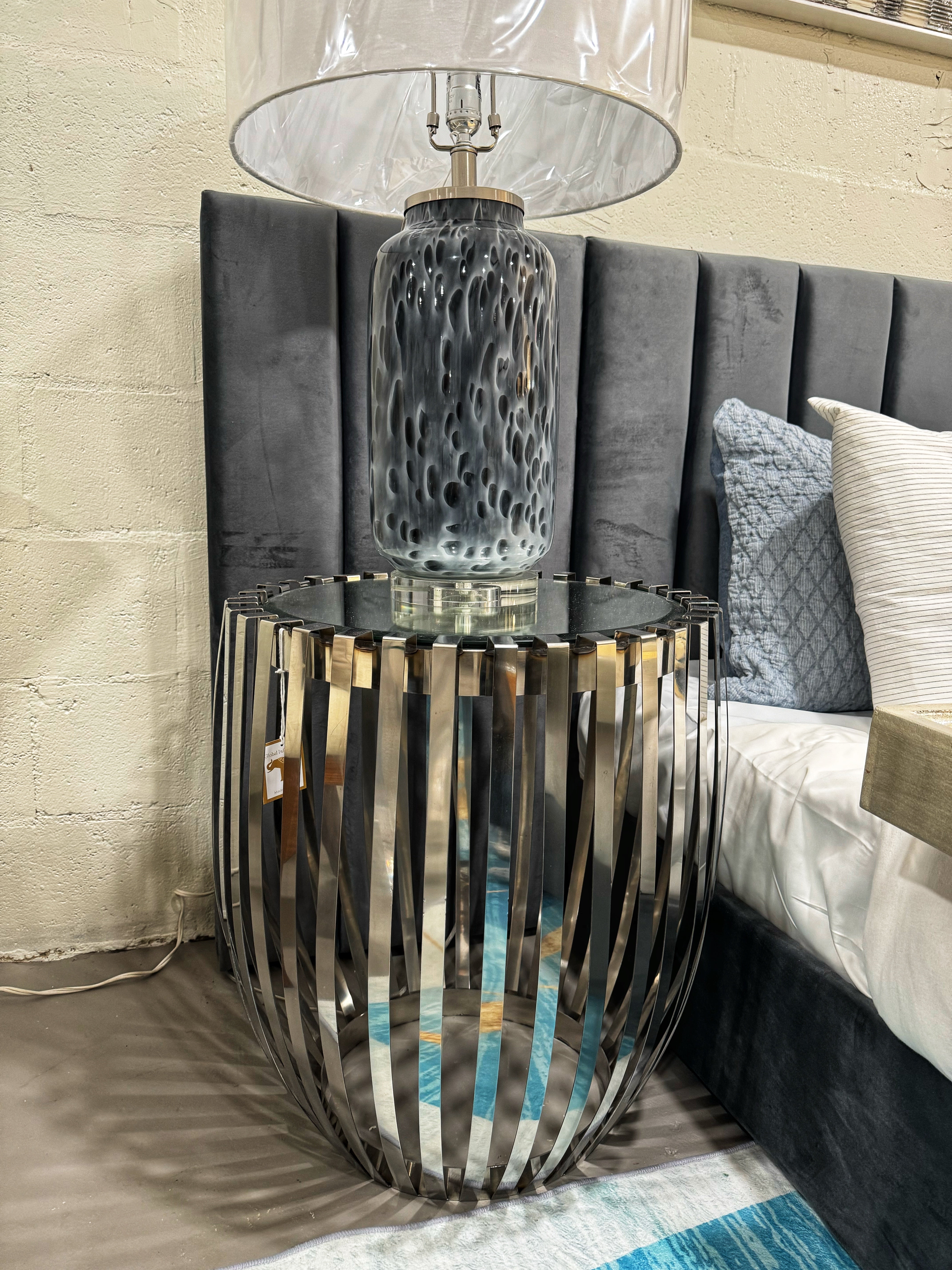 The Design

Clean, polished steel ribs form the body of this drum style table with mirrored top. Very simple and sophisticated, this table will glide right into your contemporary room design.

The Features

Sophisticated mirror top furthers the contemporary aesthetic.

Product Details

80% Stainless Steel,20% Glass