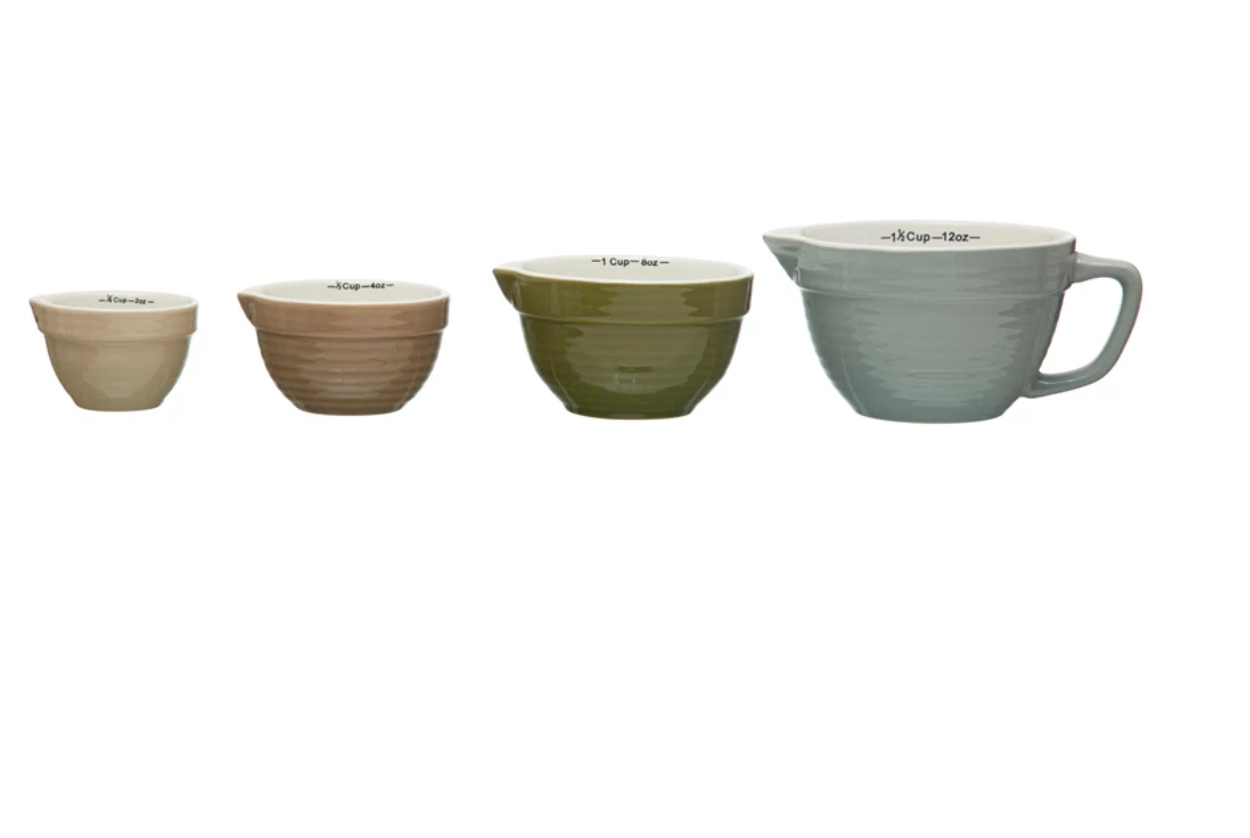 This classically designed set of batter bowl measuring cups features stoneware construction in 4 versatile hues. This piece is food safe. Dishwasher safe. Made from stoneware.