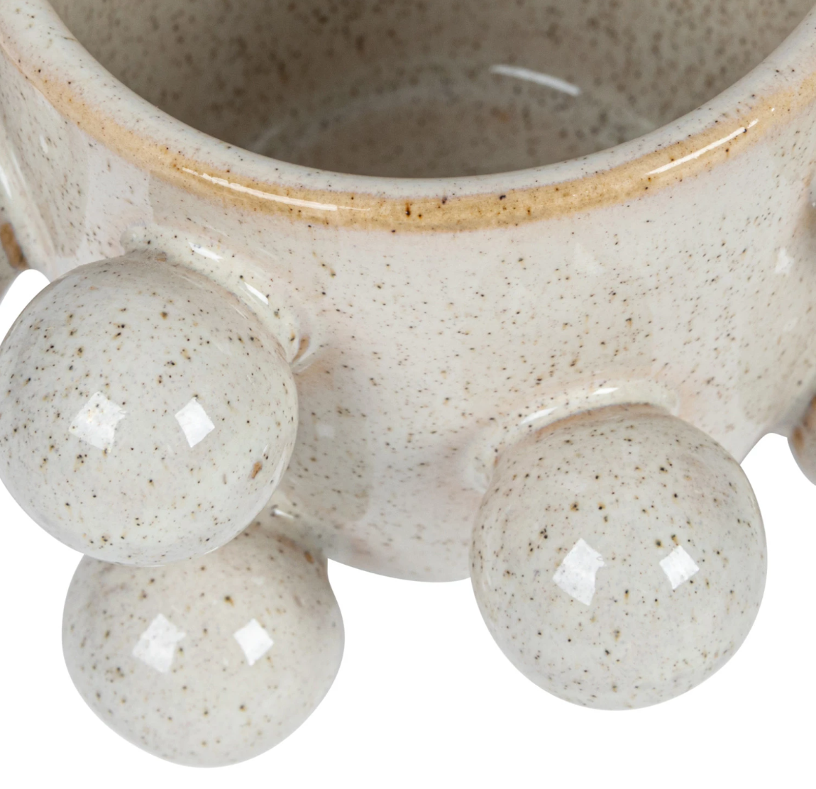 A round stoneware planter with speckled cream color and reactive glaze, featuring multiple orbs on the side.