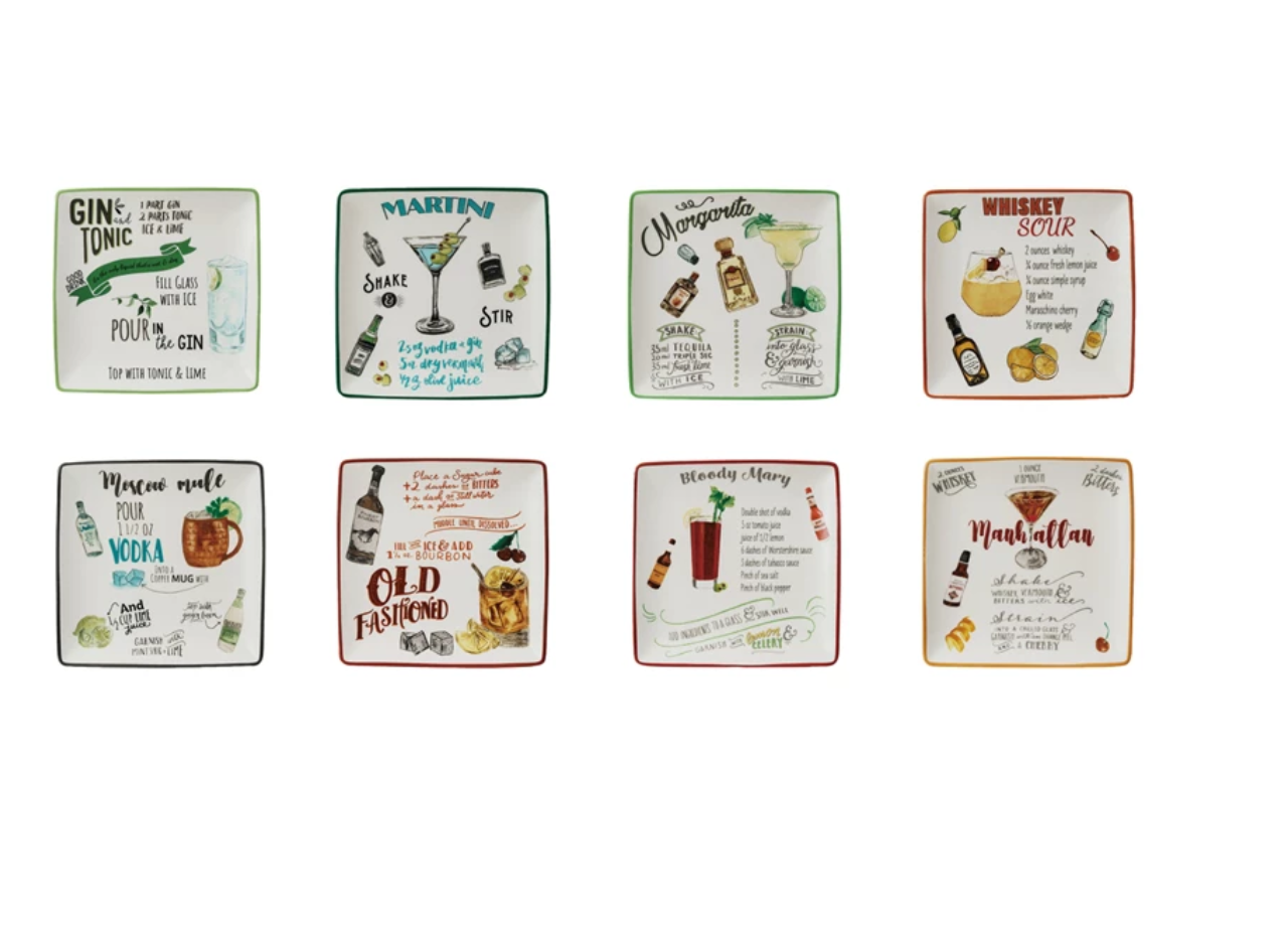 A collection of stoneware plates each with a different cocktail recipe and artistic design.
