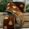 Measuring 2.5" wide and 5 yards long, this luxurious ribbon features delightful bee embroidery, beautifully contrasting against the rich brown velvet. Perfect for gift wrapping, crafting, or enhancing floral arrangements, its soft texture and unique design make it a versatile choice for any occasion. Bring a whimsical yet elegant flair to your creations with this charming ribbon that celebrates nature's beauty!