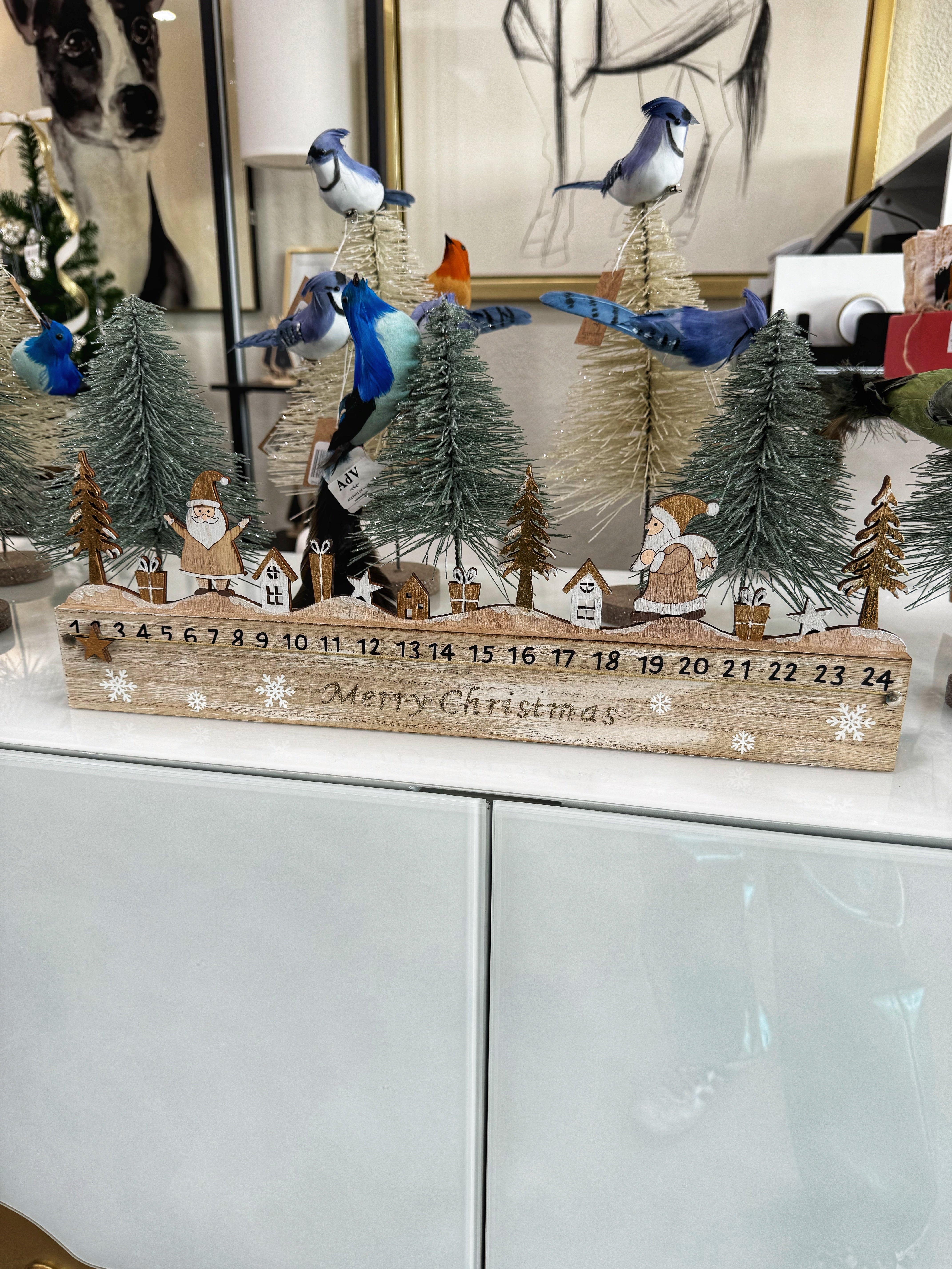 This beautifully crafted calendar features a chic design with a crisp white finish and elegant gold accents, making it a stunning addition to your holiday decor. Each numbered compartment offers a delightful surprise, perfect for filling with treats or small gifts for the countdown. Ideal for display on mantels, tabletops, or shelves, this advent calendar adds a touch of festive charm while creating lasting memories for you and your family. Celebrate the season with this elegant and functional decor piece!