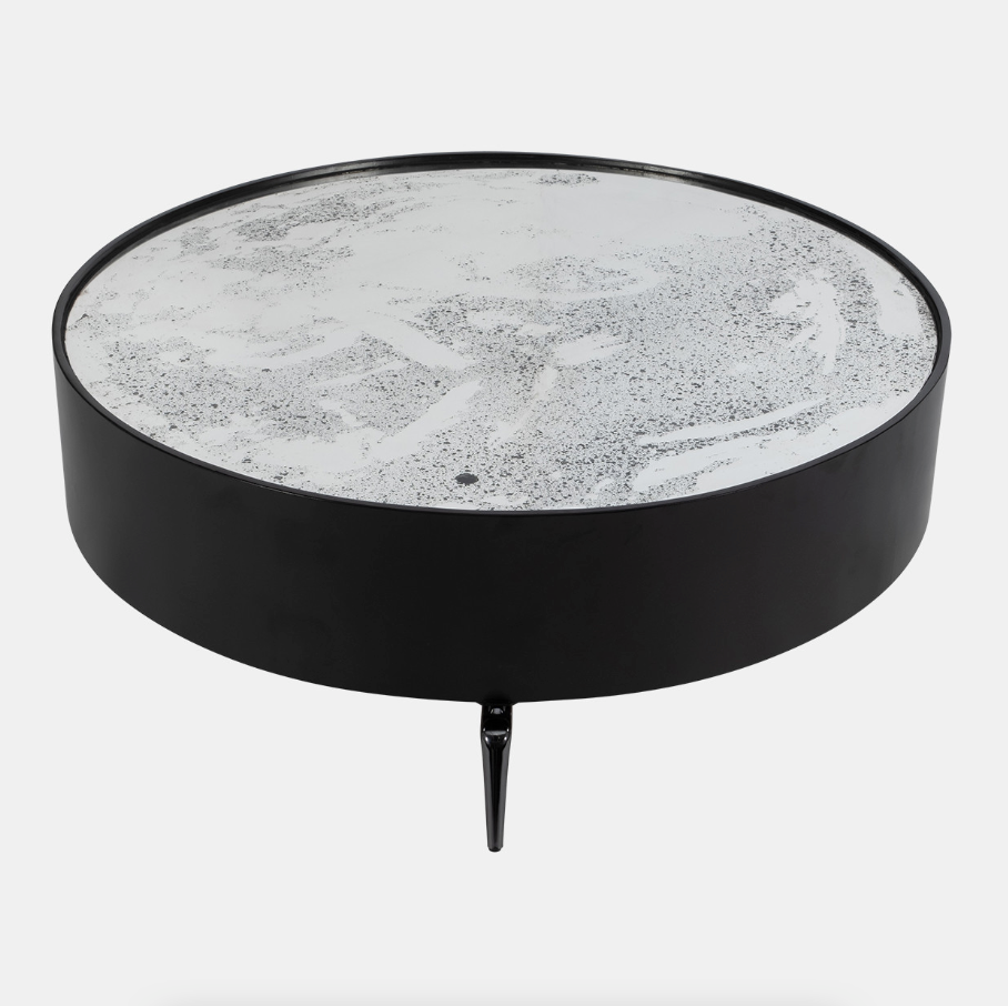 Crafted from high-quality MDF and topped with sleek glass, this coffee table is both sturdy and stylish. The unique spider leg design adds a touch of contemporary flair, making it a standout centerpiece in your home. The expansive 47-inch surface provides ample space for your favorite decor, books, or beverages, while the 16-inch height ensures easy access from your sofa or chairs.