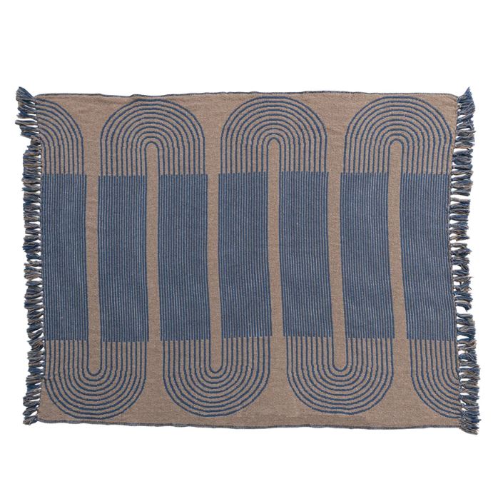 Transform the home with this woven reclaimed cotton blend throw with pattern and fringe in blue and tan. This throw blanket features a woven reclaimed cotton blend that creates a soft and cozy feel. The way adds some contrast and interest to the simple design. The pattern is abstract and colorful, giving the throw a contemporary and cheerful look. The fringe adds some texture and flair to the edges of the throw. The blue and tan color is fresh and elegant and can blend with any color scheme or theme. 