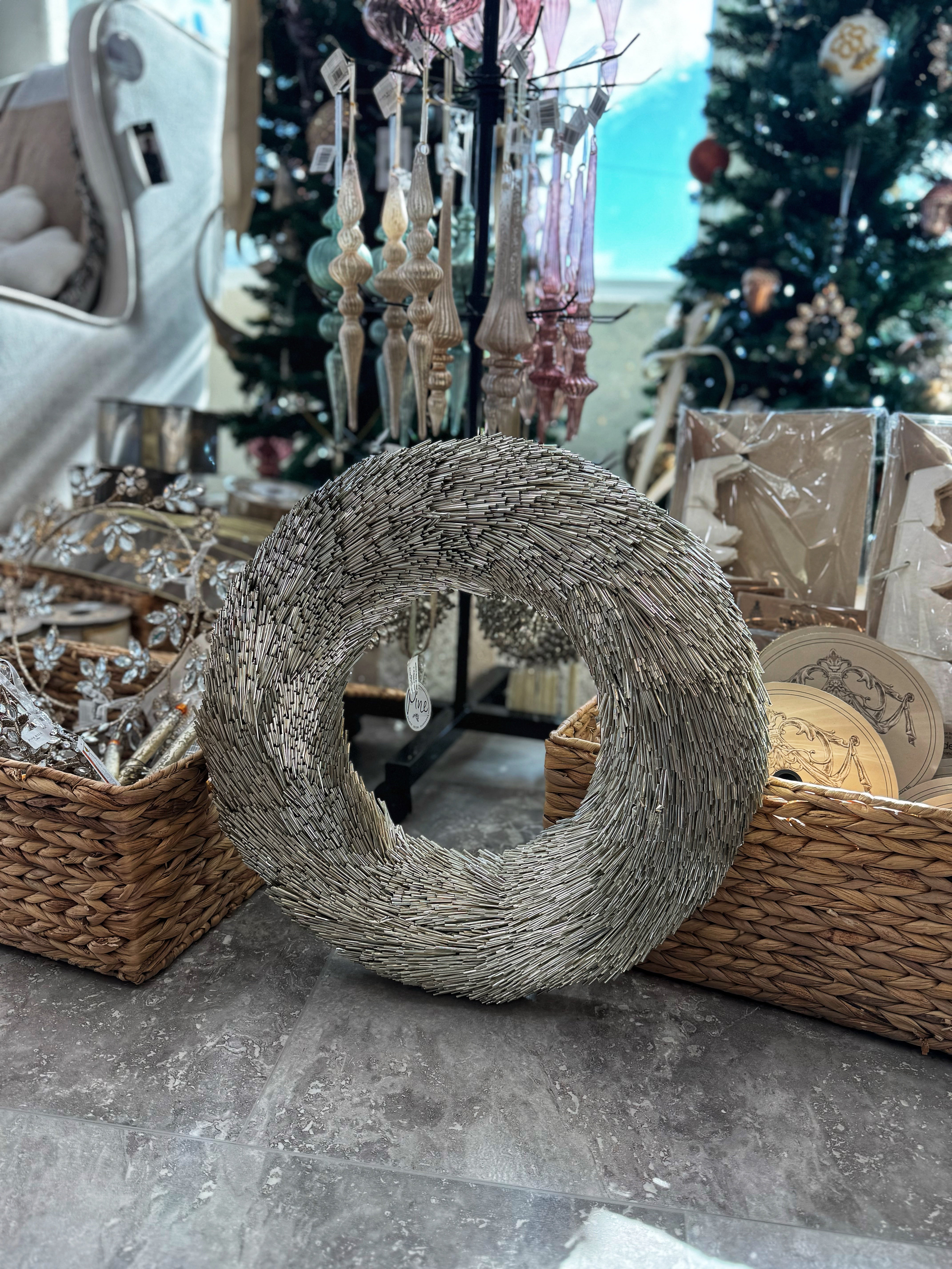 Decorate your home this holiday season with our 18" Gold Plastic Straw Wreath. This stunning piece features a unique design that combines a straw texture with a radiant gold finish, creating a chic and festive look. Perfect for hanging on doors, walls, or as part of a centerpiece, this wreath adds a touch of elegance and sparkle to your holiday decor. 